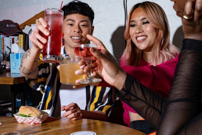 A group of friends of varying genders making a toast1